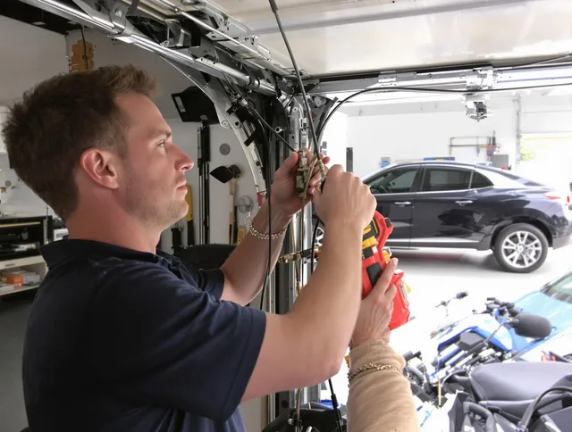 Fort Carson Garage Door Repair safety certified technician performing cable replacement in Fort Carson
