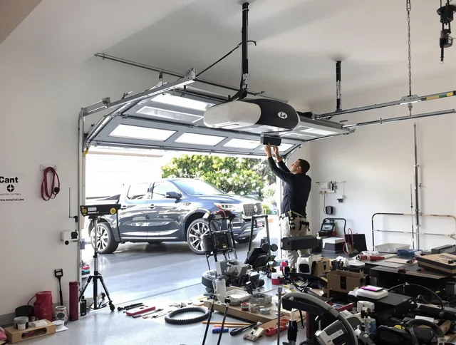 Fort Carson Garage Door Repair specialist installing smart garage door opener system in Fort Carson home