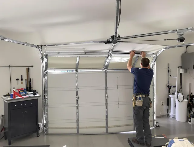 Fort Carson Garage Door Repair specialist performing precise section replacement on Fort Carson garage door